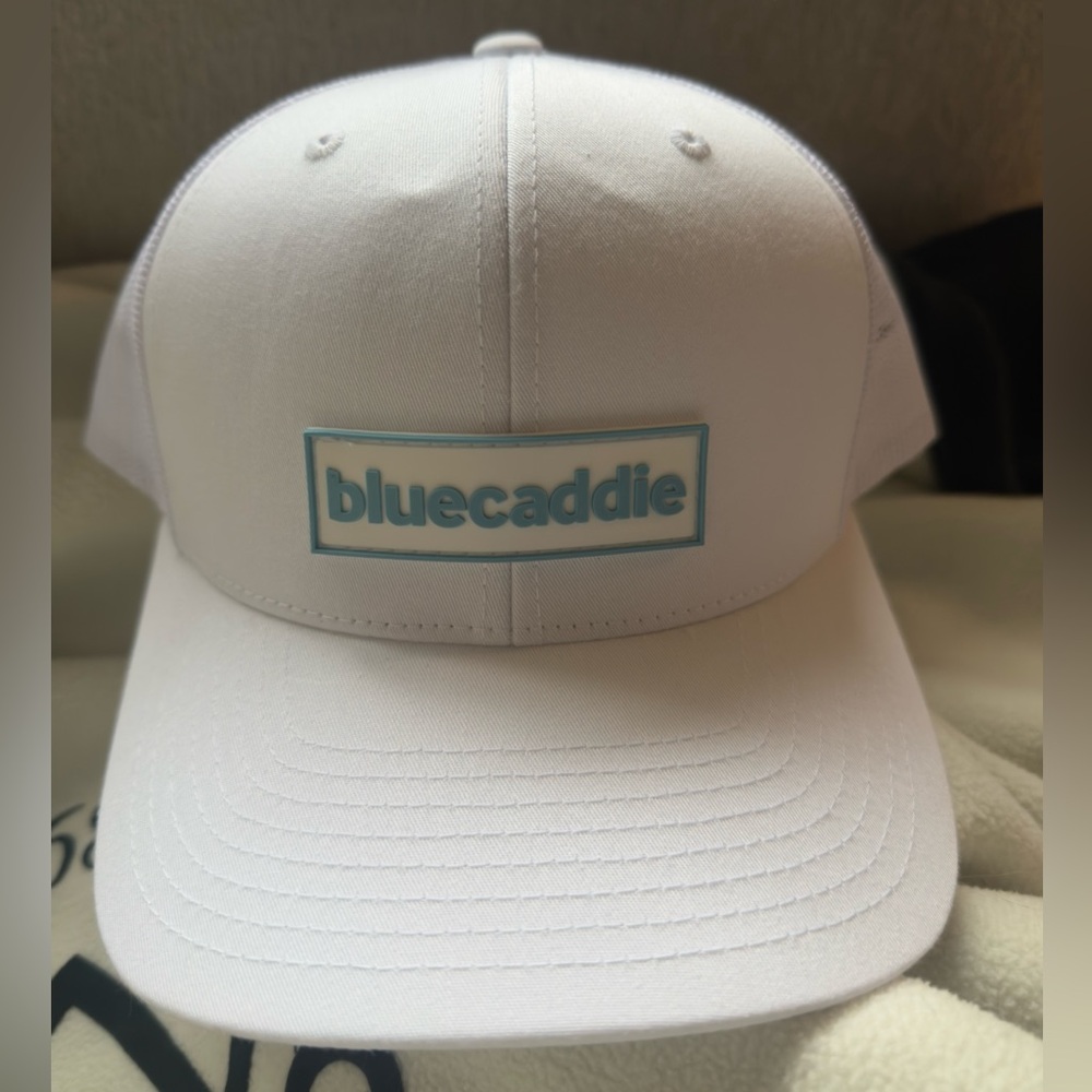 BlueCaddie White Trucker Hat. Adjustable Plastic Snap. 6 Panel. New.